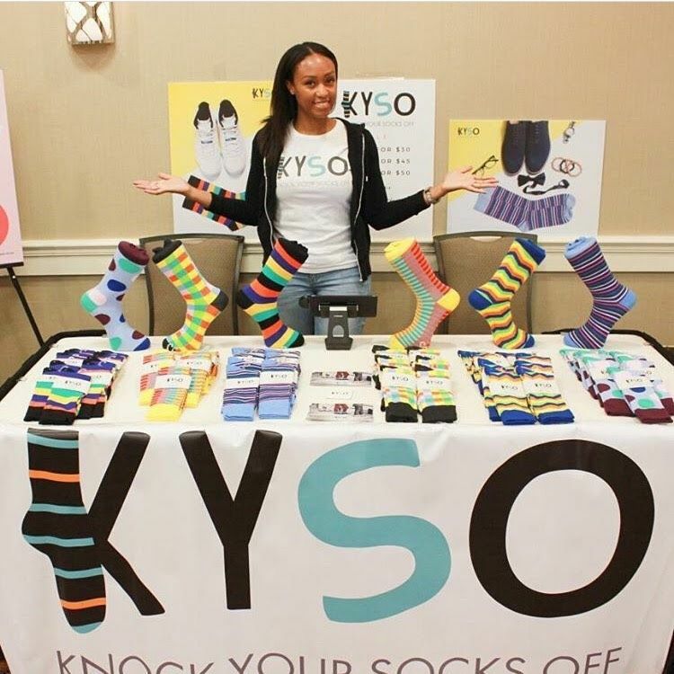 Marisa Walcott displaying Kyso socks at a pop up event